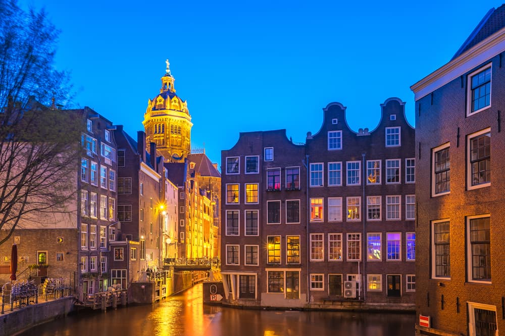 Amsterdam city at night in Netherlands.