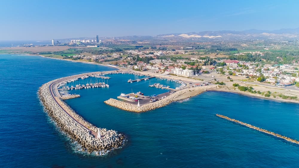 Sea port city of Larnaca, Cyprus. View from the aircraft to the coastline, beaches, seaport and the architecture of the city of Larnaca.
