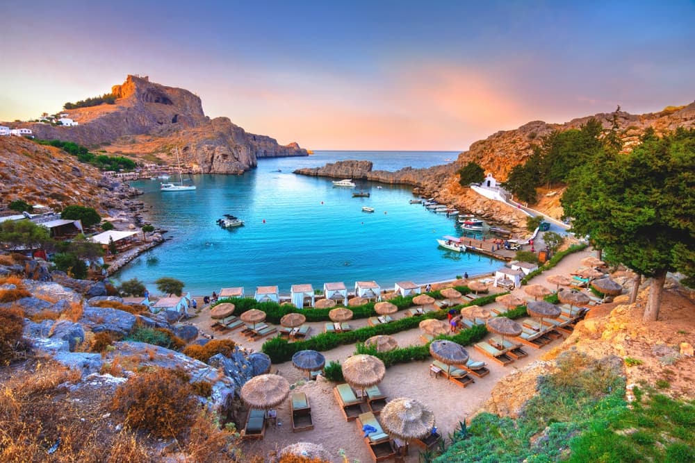 Panoramic view of St. Paul bay with acropolis of Lindos in background, Rhodes island, Greece