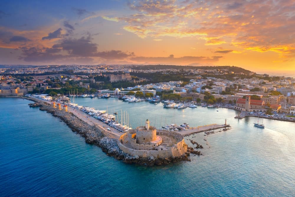Panorama of old town, famous Knights Grand Master Palace and Mandraki port, Rhodes island, Greece.